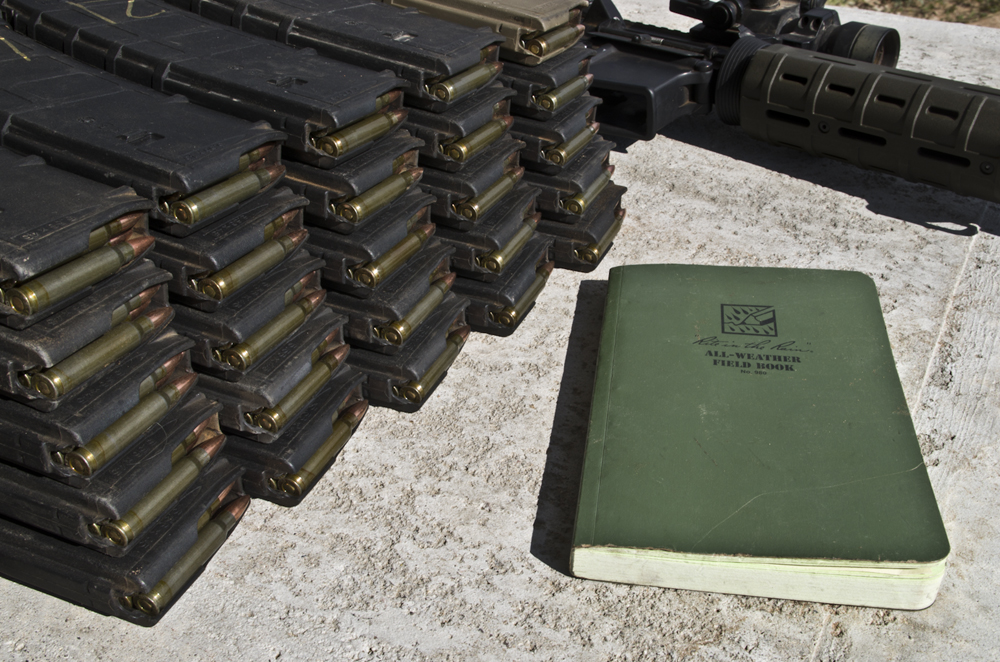 Log books and ammo magazines showing how the brass versus steel test was conducted.