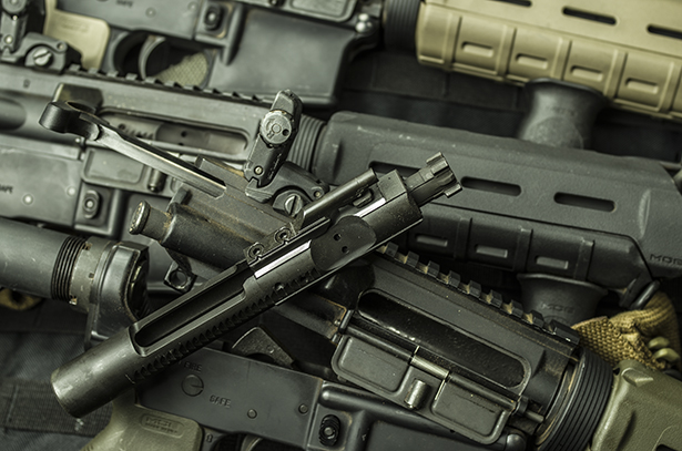 A stack of AR-15 carbines used in the brass vs. steel testing.